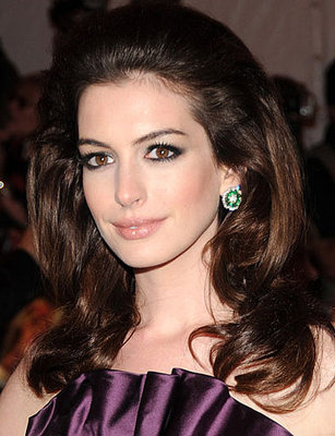 Anne Hathaway  - 2024 Dark brown hair & glamorous hair style.
