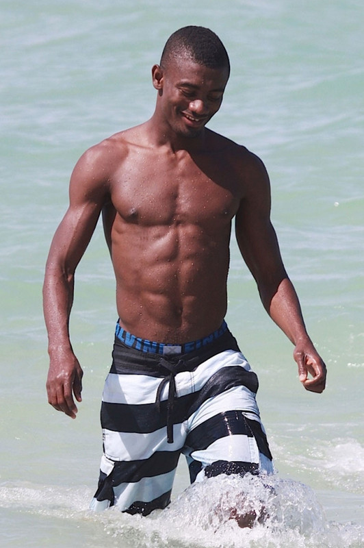 The Leo with shirtless athletic body on the beach
