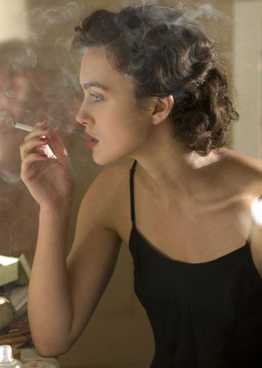 Cote de Pablo smoking a cigarette (or weed)
