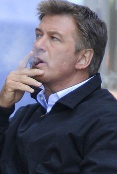 Alec Baldwin smoking a cigarette (or weed)
