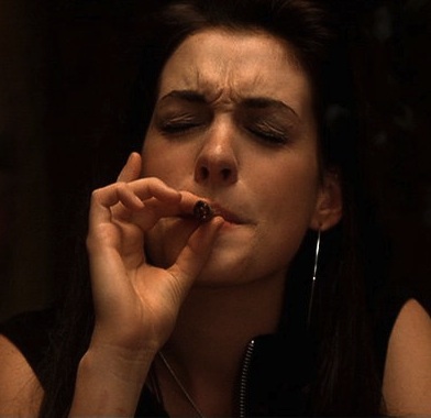 Anne Hathaway smoking a cigarette (or weed)
