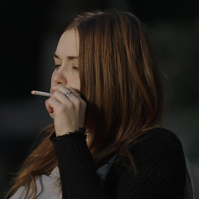 Holland Roden smoking a cigarette (or weed)
