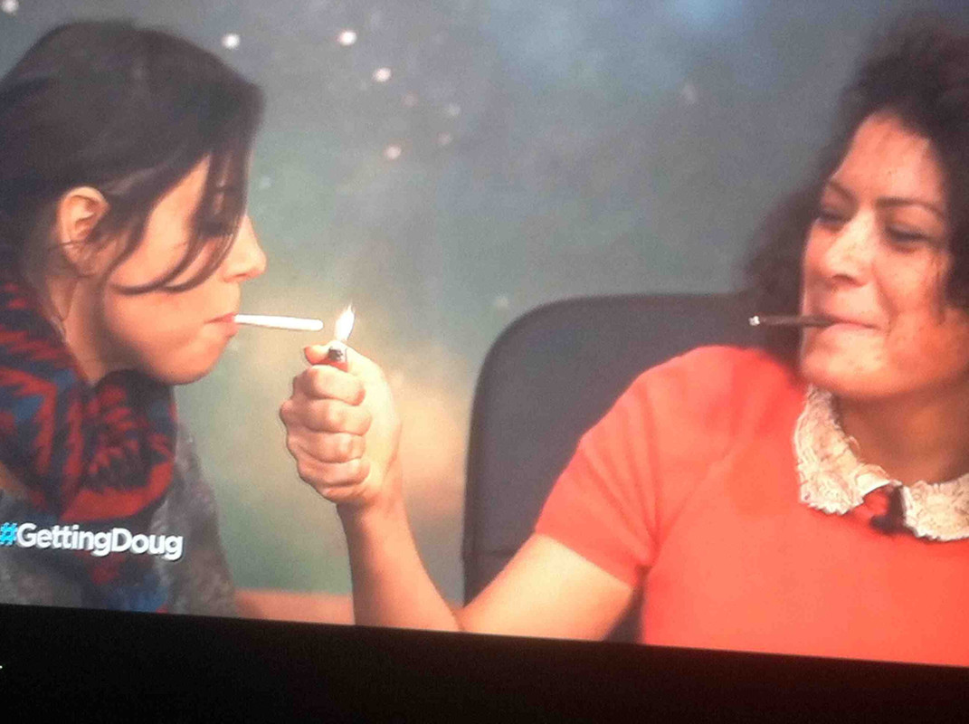 Alia Shawkat smoking a cigarette (or weed)
