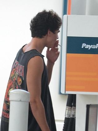 Calum Hood smoking a cigarette (or weed)
