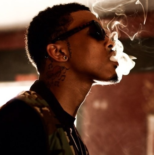 August Alsina smoking a cigarette (or weed)
