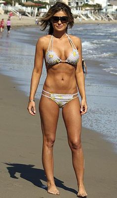 With her athletic body and Light brown hairtype without bra (cup size 36C) on the beach in bikini
