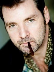 Brendan Coyle smoking a cigarette (or weed)
