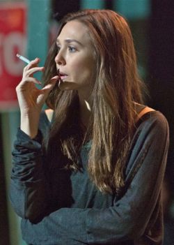 Elizabeth Olsen smoking a cigarette (or weed)
