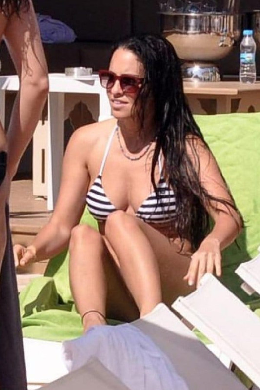 With her slim body and Light brown hairtype without bra (cup size 34B) on the beach in bikini
