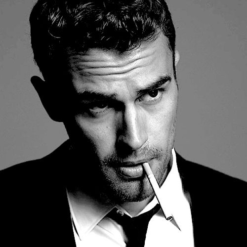 Theo James smoking a cigarette (or weed)
