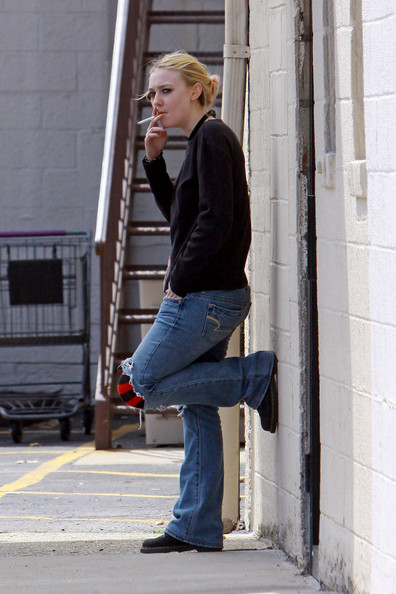 Dakota Fanning smoking a cigarette (or weed)
