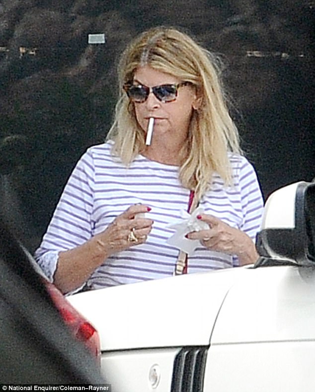 Kirstie Alley smoking a cigarette (or weed)
