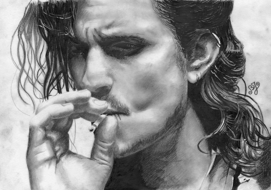 Orlando Bloom smoking a cigarette (or weed)
