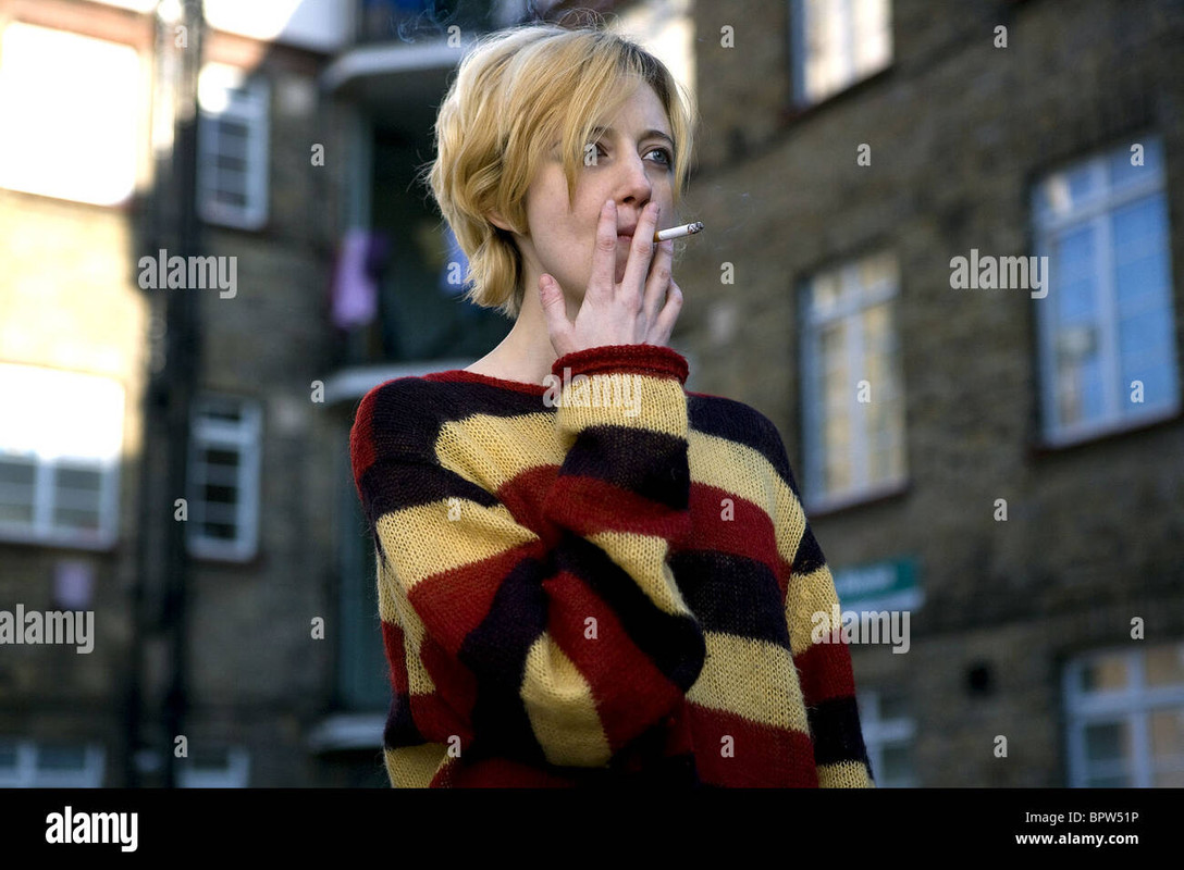 Andrea Riseborough smoking a cigarette (or weed)
