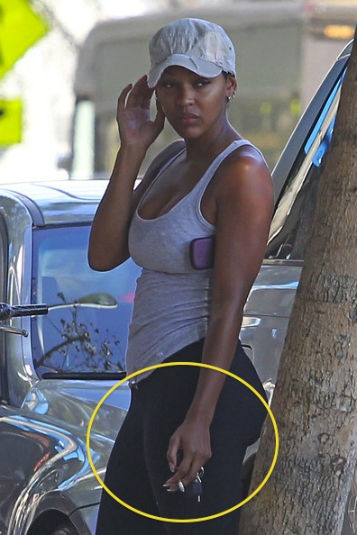 Meagan Good smoking a cigarette (or weed)
