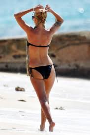 With her slim body and Light blond hairtype without bra (cup size 32A) on the beach in bikini
