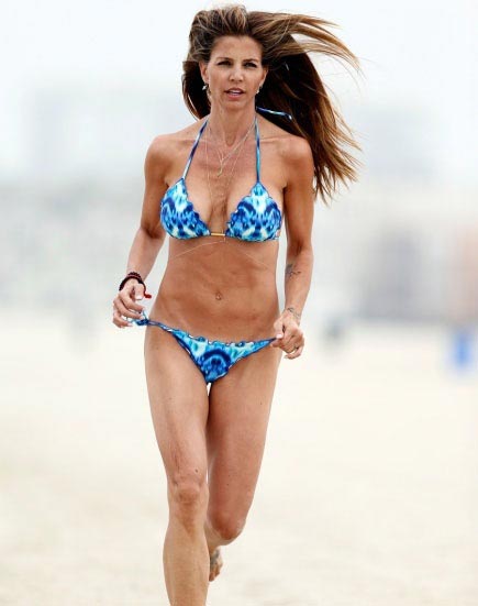 With her slim body and Dark brown hairtype without bra (cup size 36C) on the beach in bikini
