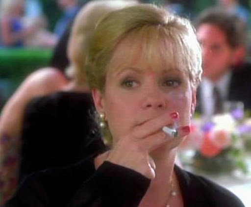 Bonnie Hunt smoking a cigarette (or weed)
