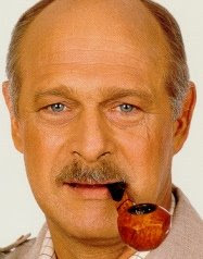 Gerald McRaney smoking a cigarette (or weed)
