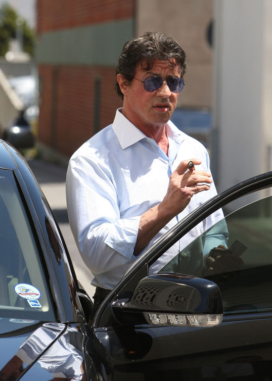 Sylvester Stallone smoking a cigarette (or weed)
