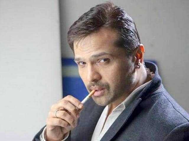 Himesh Reshammiya smoking a cigarette (or weed)
