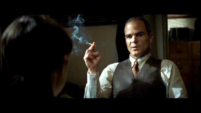 Michael Kelly smoking a cigarette (or weed)
