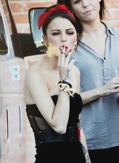 Cher Lloyd smoking a cigarette (or weed)
