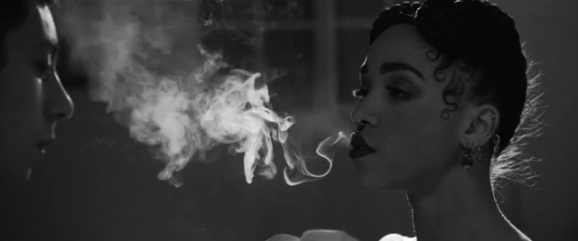 FKA Twigs smoking a cigarette (or weed)
