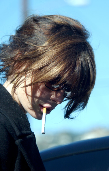 Lara Flynn Boyle smoking a cigarette (or weed)
