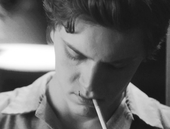 Evan Peters smoking a cigarette (or weed)
