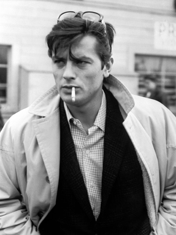 Alain Delon smoking a cigarette (or weed)
