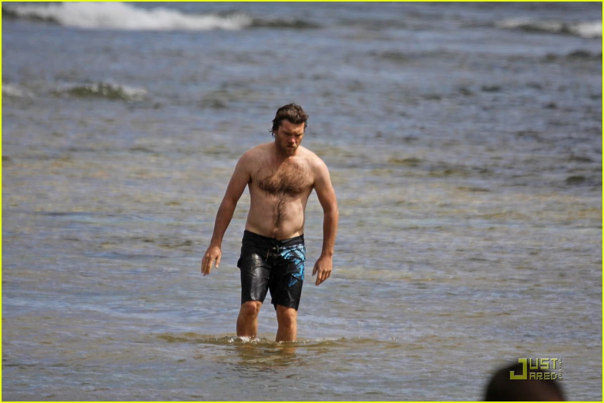 The Leo with shirtless athletic body on the beach
