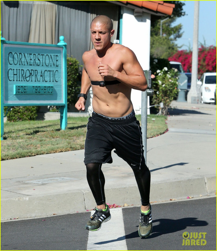 The Gemini with shirtless athletic body on the beach
