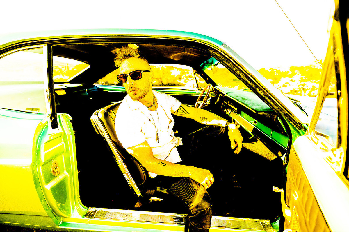 Photo of Greg Puciato  - car
