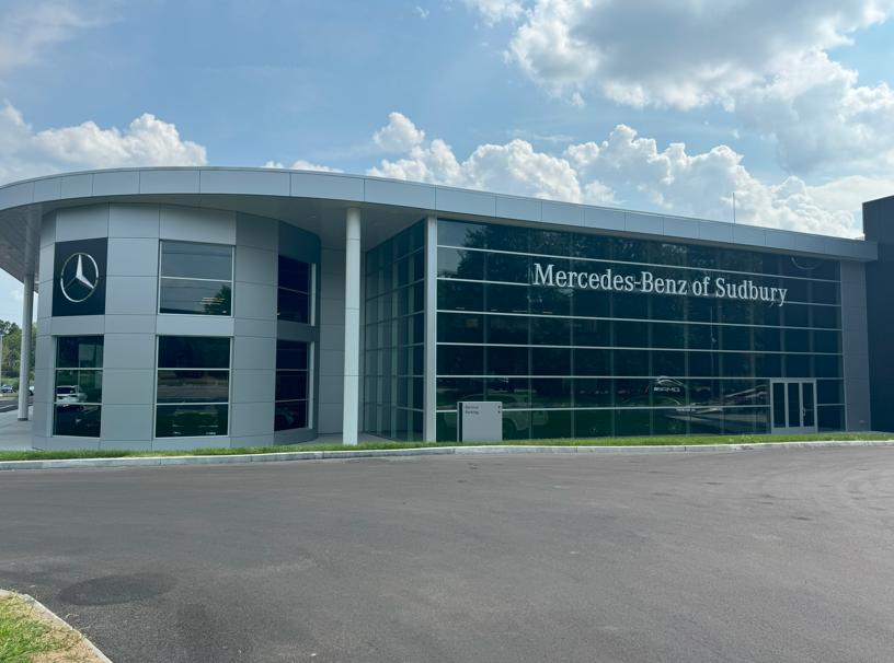 front view of exterior Mercedes-Benz of Sudbury dealership with front doors open