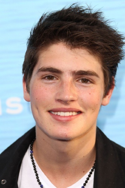 Gregg Sulkin  - 2024 Dark brown hair & chignon hair style.
