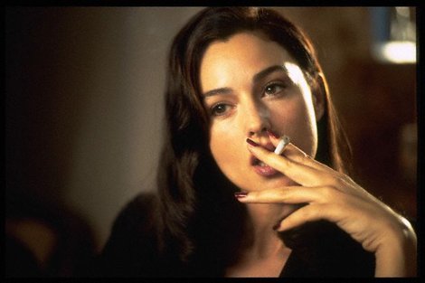 Monica Bellucci smoking a cigarette (or weed)
