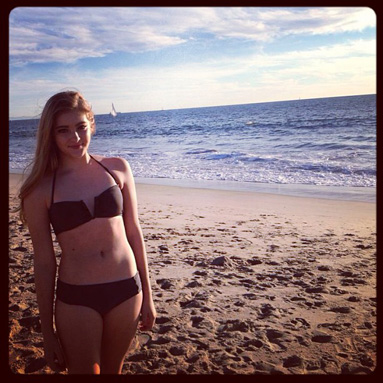 With her slim body and Light brown hairtype without bra (cup size ) on the beach in bikini
