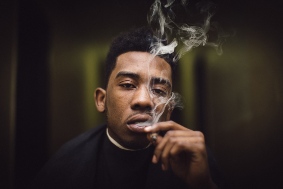 Desiigner smoking a cigarette (or weed)
