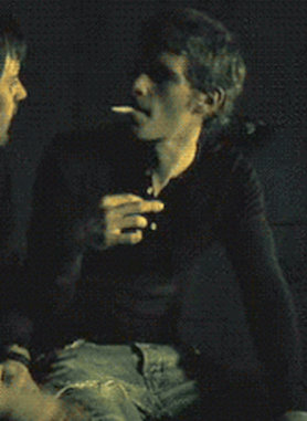 Joseph Morgan smoking a cigarette (or weed)
