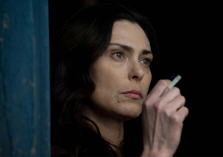 Michelle Forbes smoking a cigarette (or weed)
