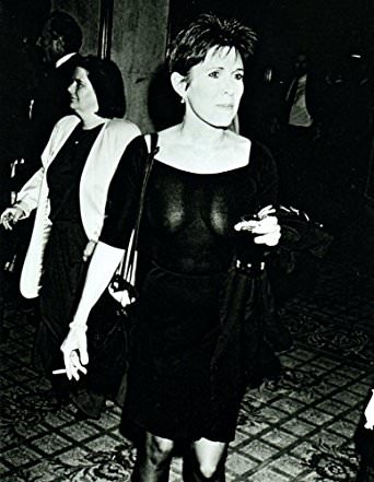 Carrie Fisher smoking a cigarette (or weed)
