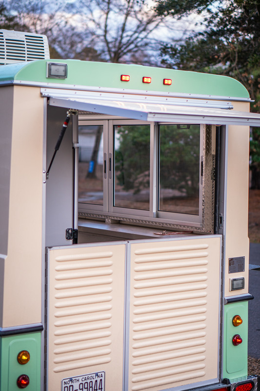 Barista pulling espresso shots at Common Tides mobile coffee trailer
