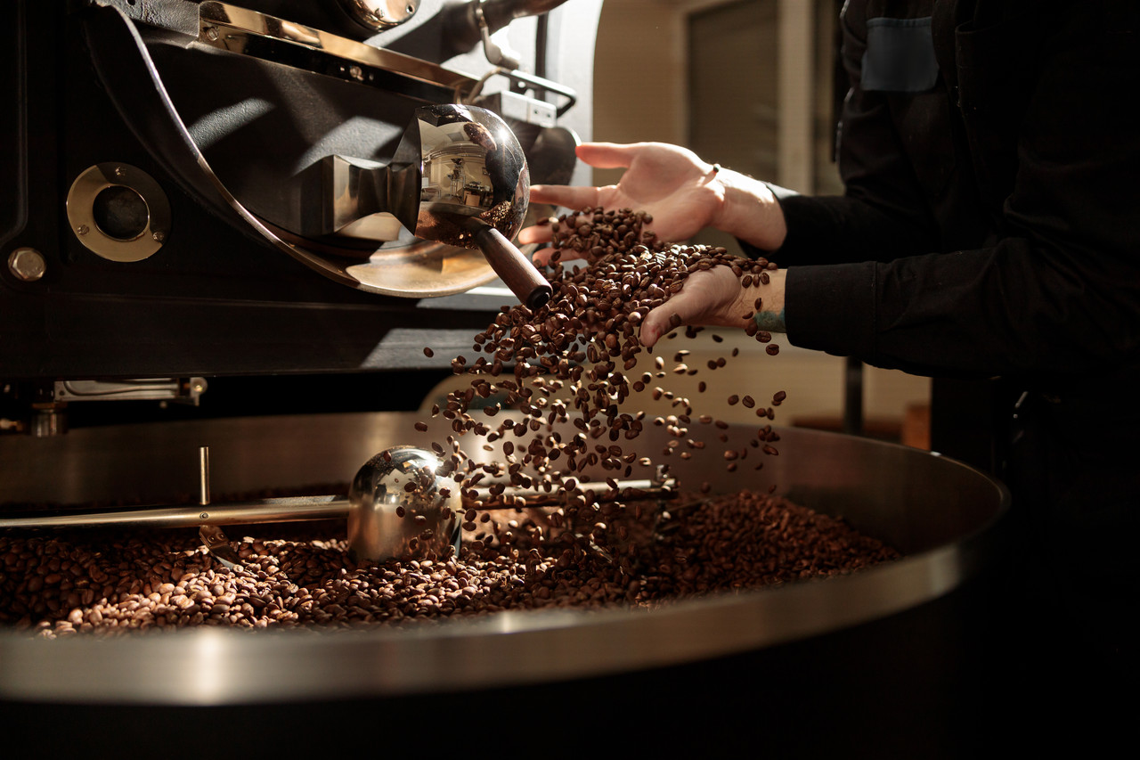 Professional coffee roasting process at Meridian Roastery