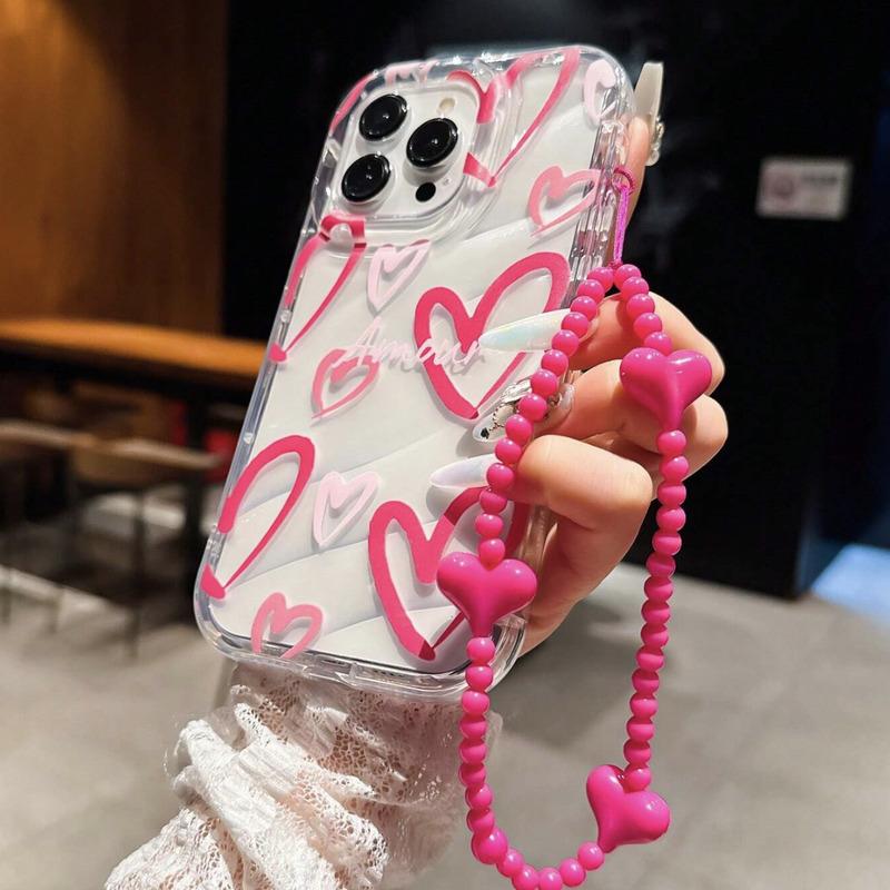 Foto de Funda transparente con diseño corazón. Incluye correa de mano.