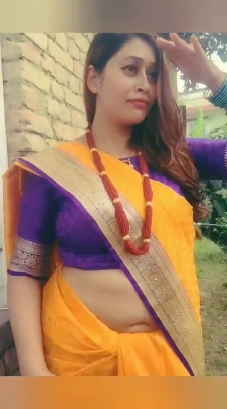 Beautiful Nepali Aunty Sexy open Big Deep Navel in Orange Saree.mp4_snapshot_00.13.217