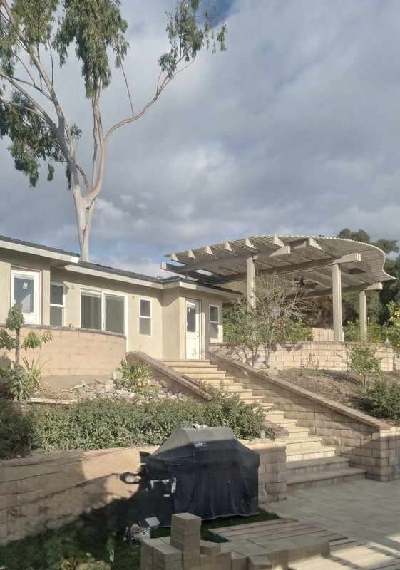 A beautiful modern custom home exterior at dusk