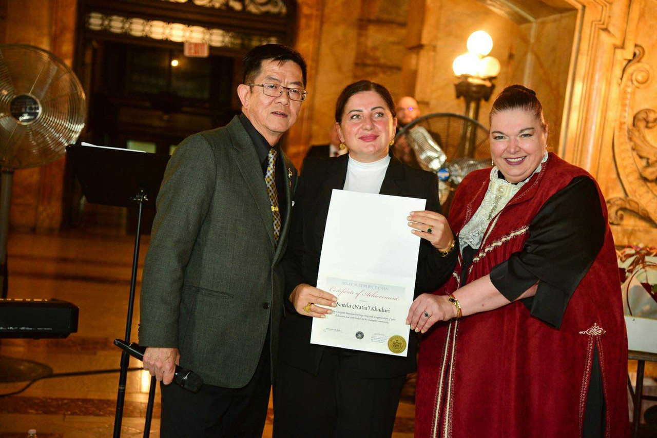 Natia receiving an award from the New York State Senate.