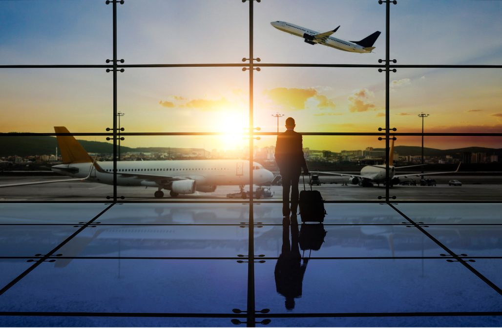 A person working on a laptop in a modern office, representing business efficiency.