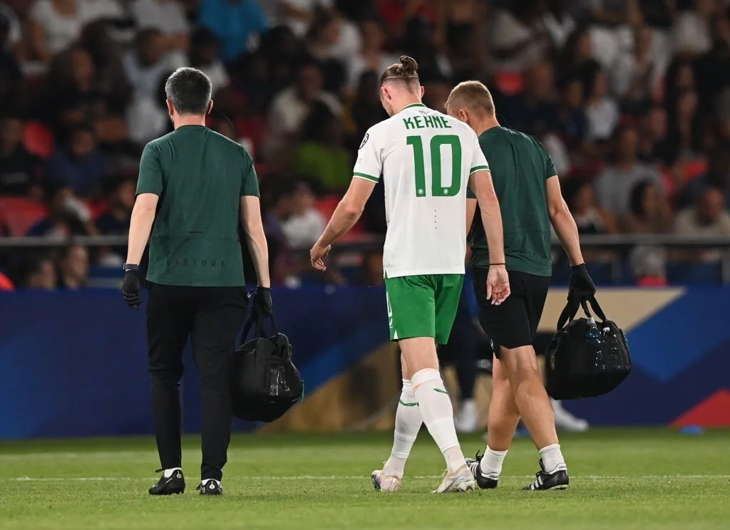 Will Keane of Republic of Ireland leaves the pitch after picking up an injury
